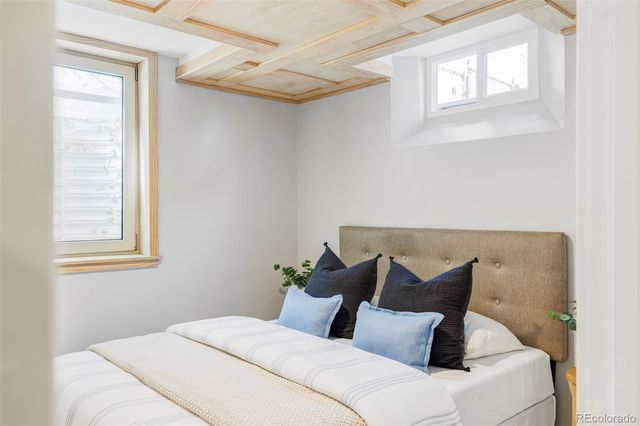 a bedroom with bed and window