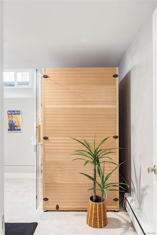 a vase of flowers sitting on a floor