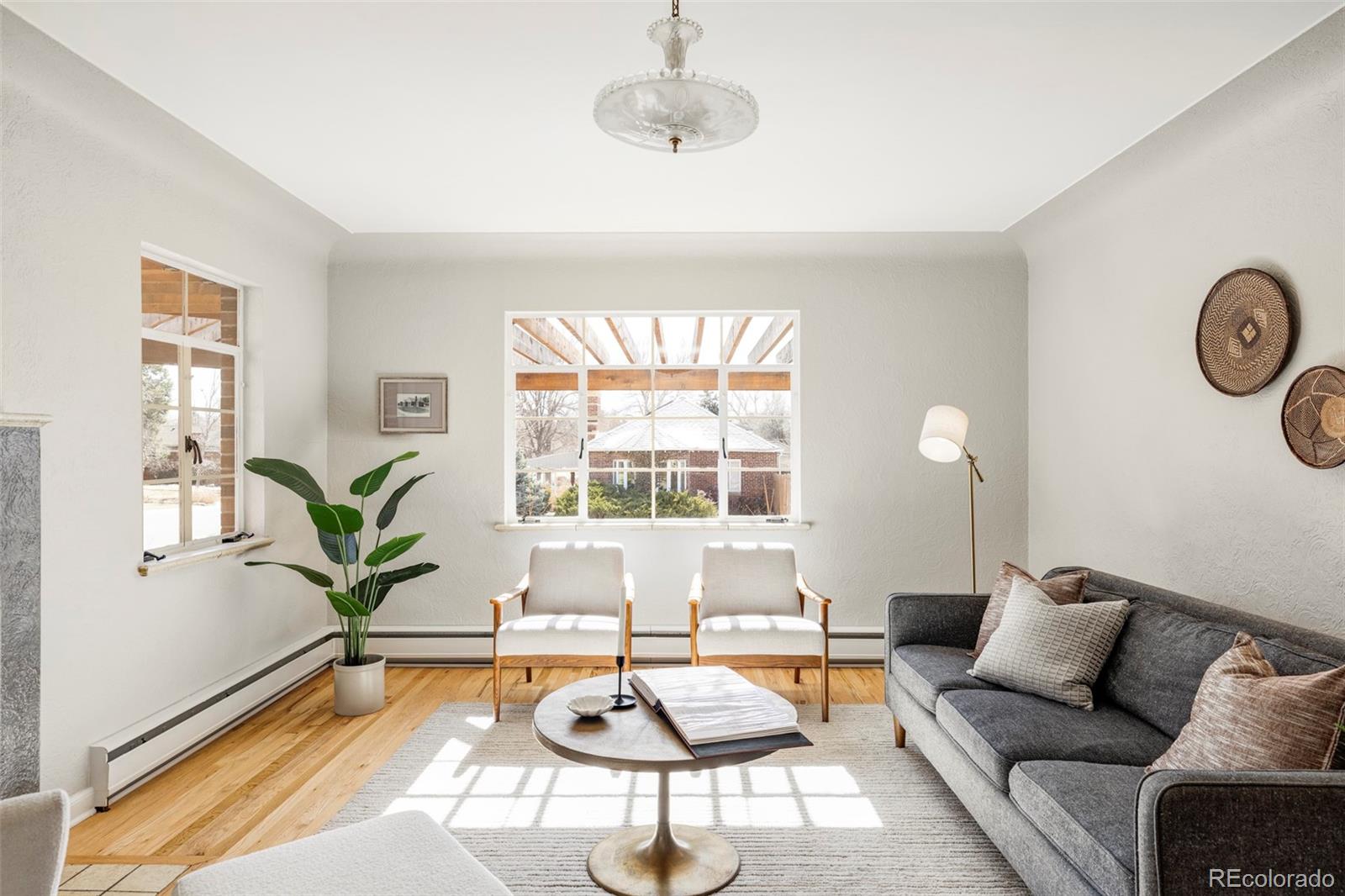 1201 Fairfax Street Denver, CO 80220 - Photo 5 of 40 a living room with furniture and a large window