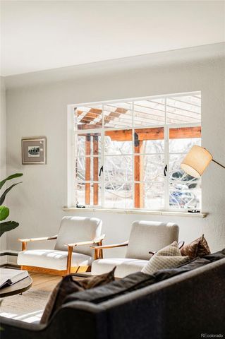 a view of a window and a kitchen area with furniture