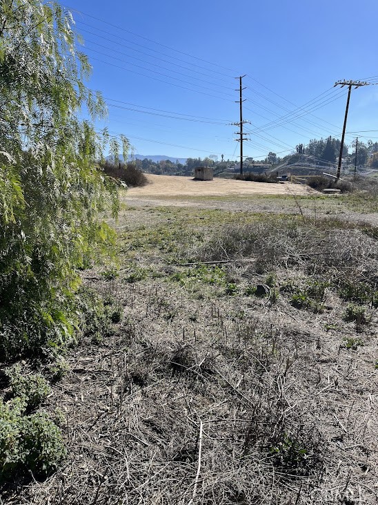 30925 Nicolas Road Temecula, CA 92591 - Photo 7 of 7 a view of a dry yard with wooden fence