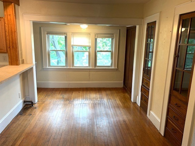237 Bridge Street Northampton, MA 01060 - Photo 12 of 14 a view of an empty room with wooden floor and a window