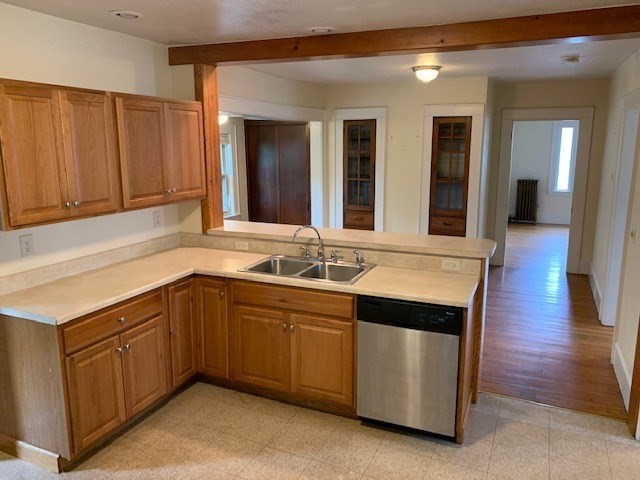 237 Bridge Street Northampton, MA 01060 - Photo 5 of 14 a kitchen with stainless steel appliances granite countertop wooden cabinets a sink and dishwasher