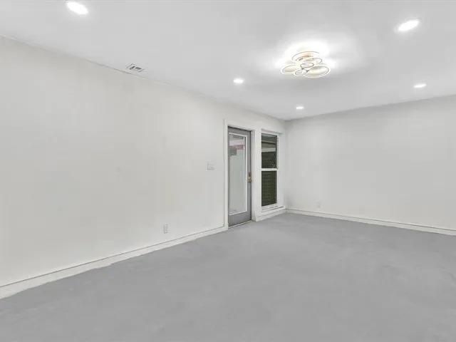 a view of a kitchen with a sink and cabinets