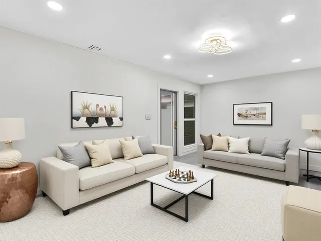 a view of kitchen with furniture and refrigerator