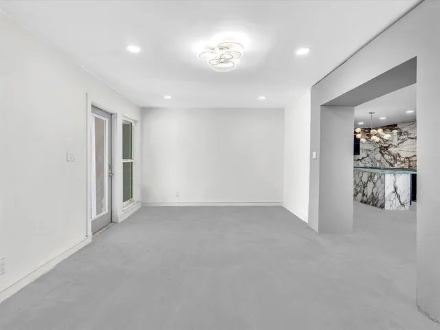 a kitchen with a refrigerator and a sink