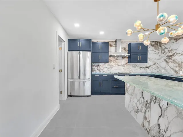 a bedroom with a large bed and a flat screen tv