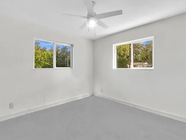 a view of a house with backyard and garden