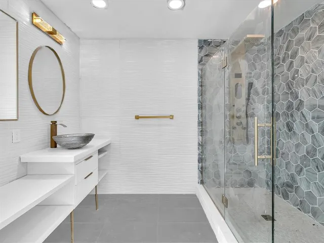 an aerial view of residential building and parking space