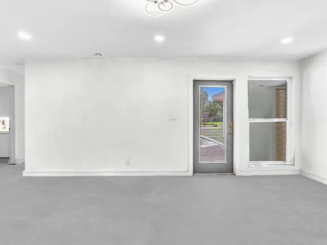 a view of an empty room and window