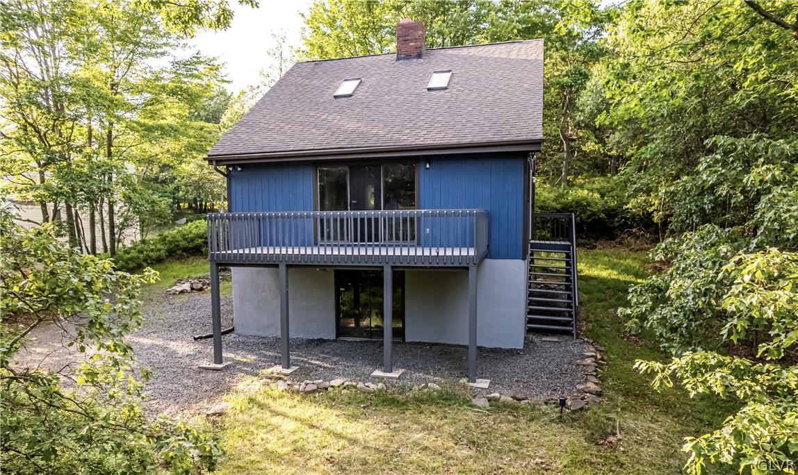 1460 Clover Road Long Pond, PA 18334 - Photo 1 of 25 a view of small house with yard and seating area