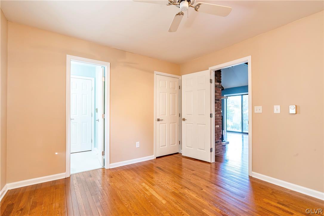 1460 Clover Road Long Pond, PA 18334 - Photo 13 of 25 a view of an empty room with wooden floor