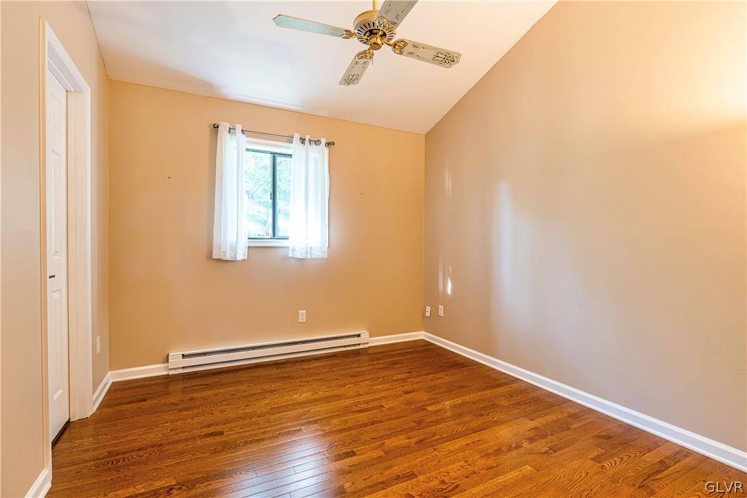 1460 Clover Road Long Pond, PA 18334 - Photo 19 of 25 an empty room with wooden floor and windows