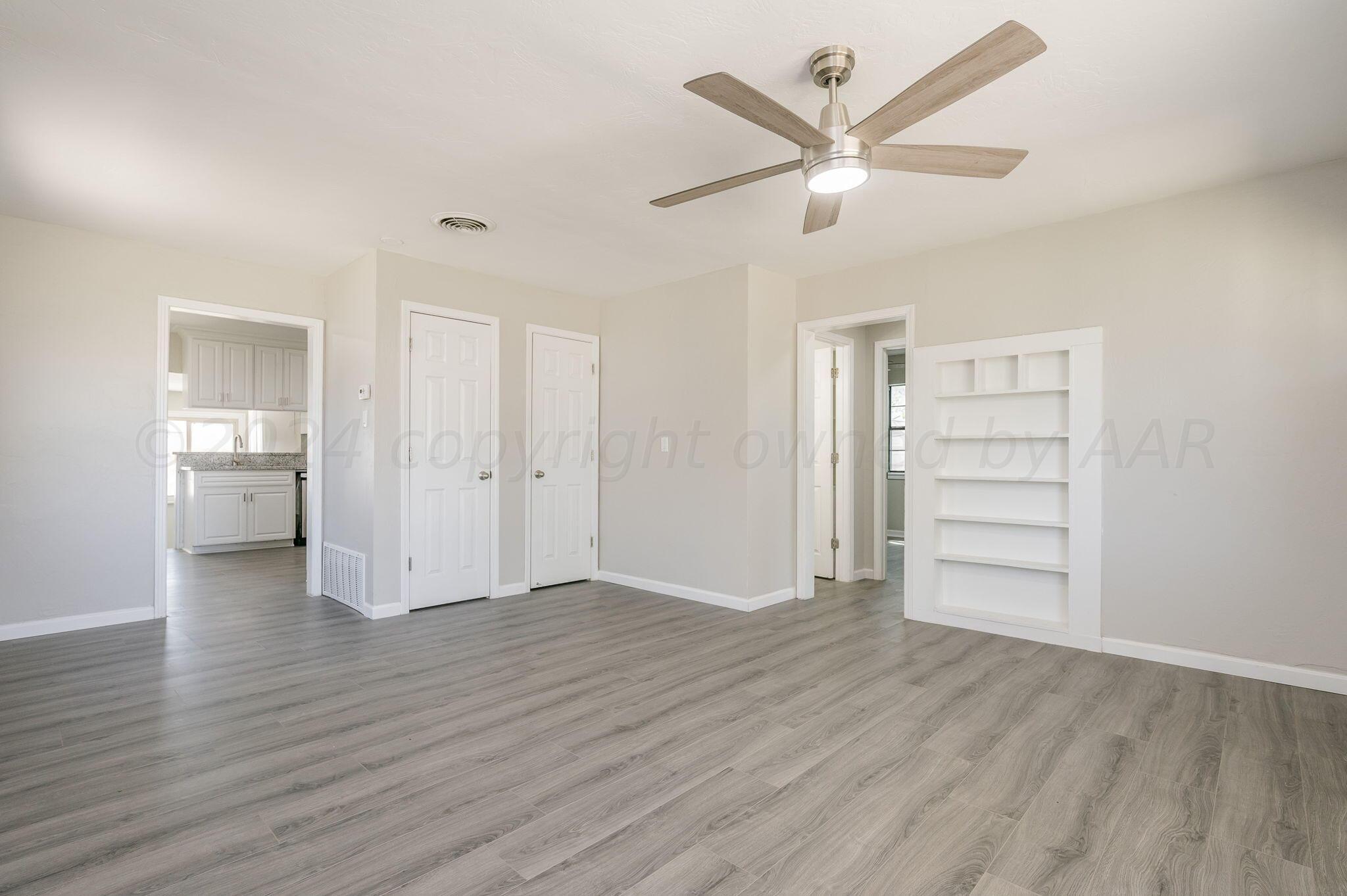 4013 South Jackson Street Amarillo, TX 79110 - Photo 6 of 18 a view of a livingroom with a hardwood floor