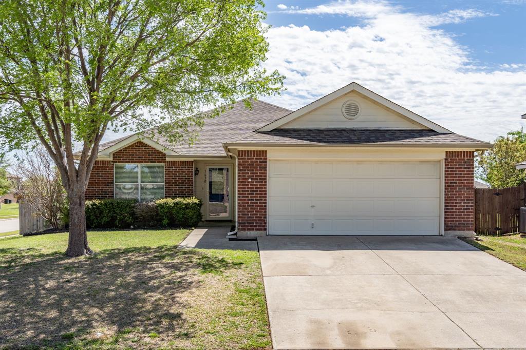 1630 Withers Way Krum, TX 76249 - Photo 1 of 1 a front view of a house with a yard and garage