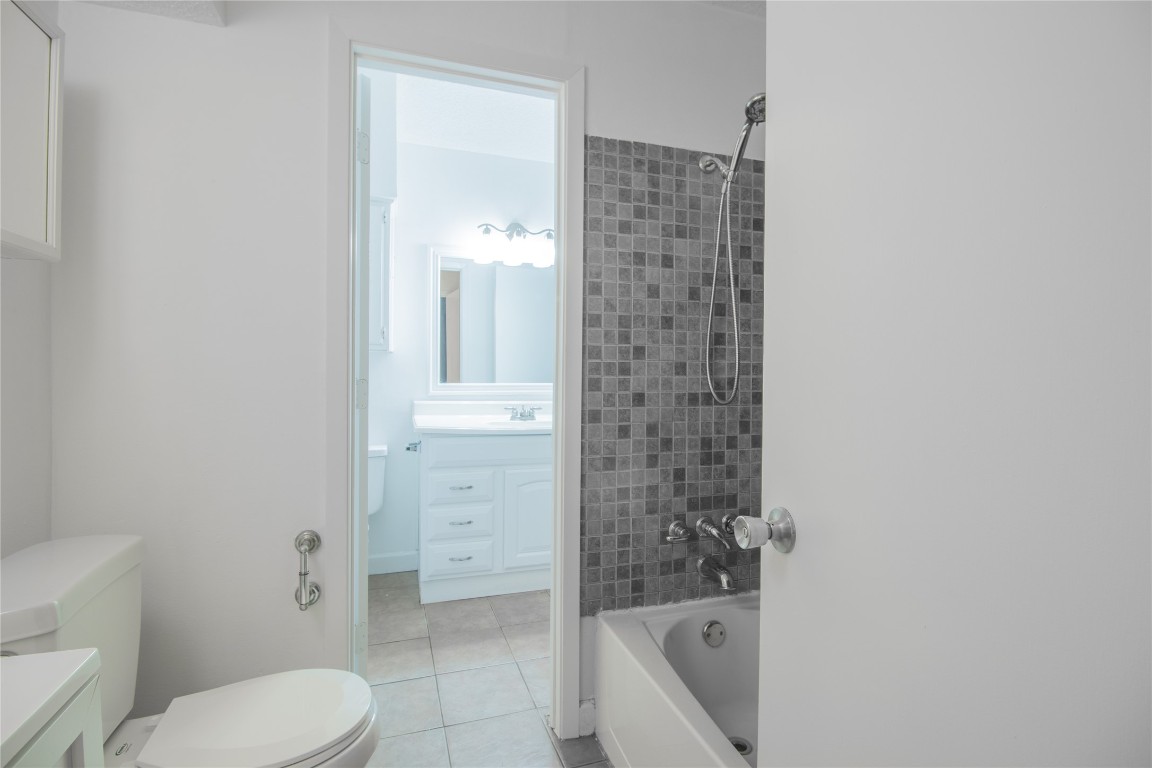 709 Castle Ridge Road, Unit D Austin, TX 78746 - Photo 15 of 19 a bathroom with a toilet and a shower
