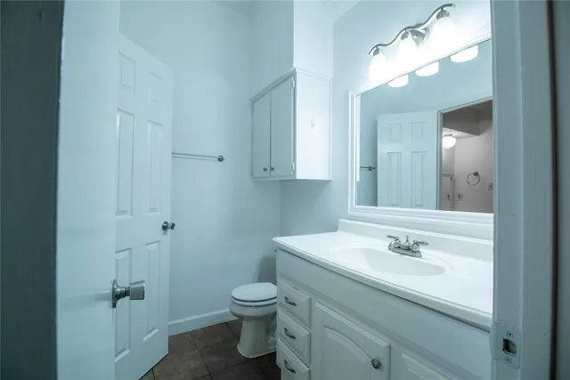 a bathroom with a sink vanity and a mirror