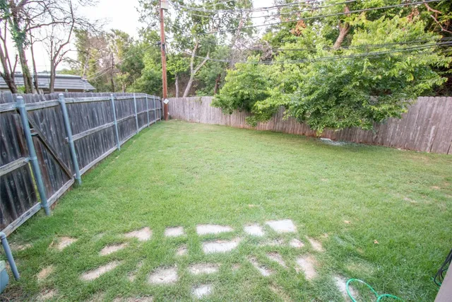 a view of a backyard with a trees