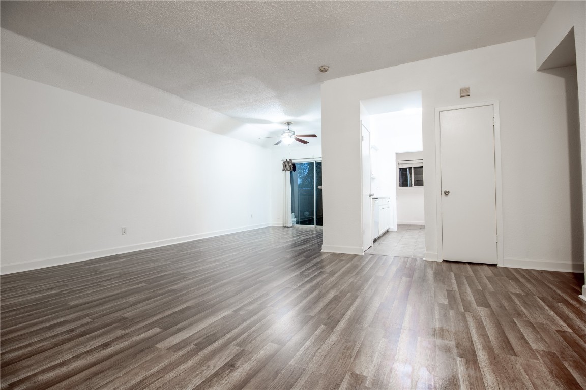 709 Castle Ridge Road, Unit D Austin, TX 78746 - Photo 9 of 19 wooden floor in an empty room