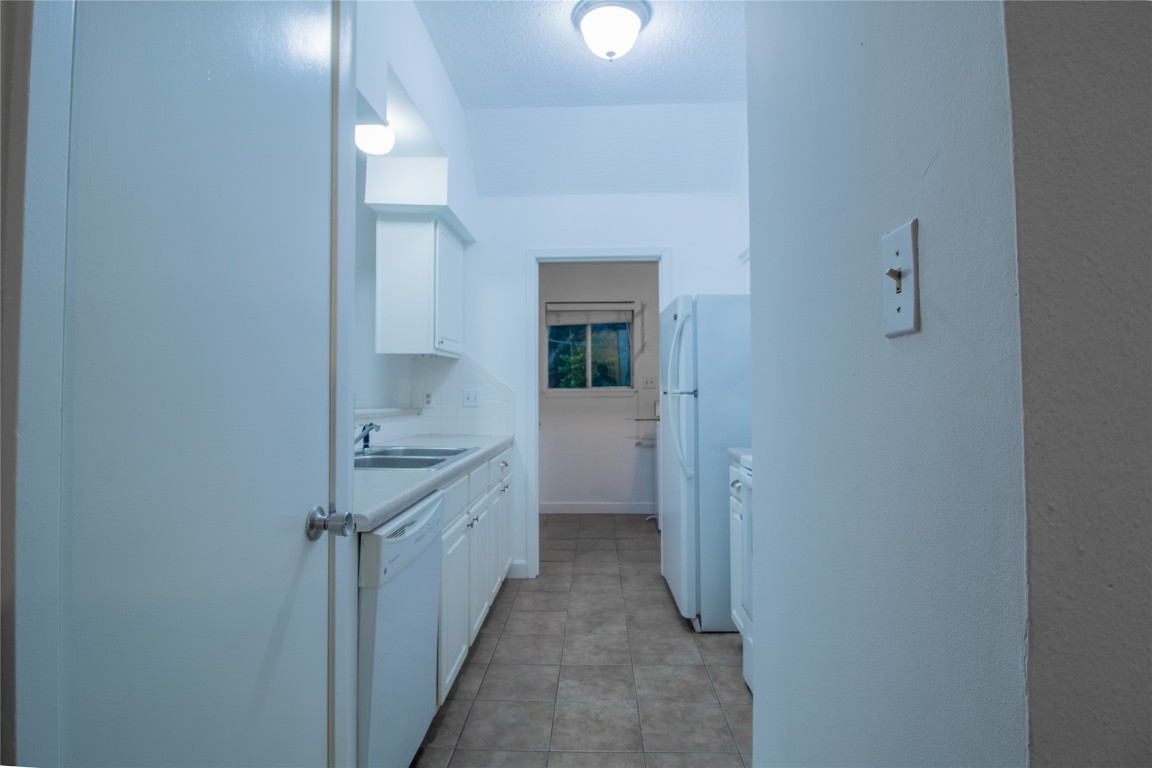 709 Castle Ridge Road, Unit D Austin, TX 78746 - Photo 10 of 19 a bathroom with a sink and mirror
