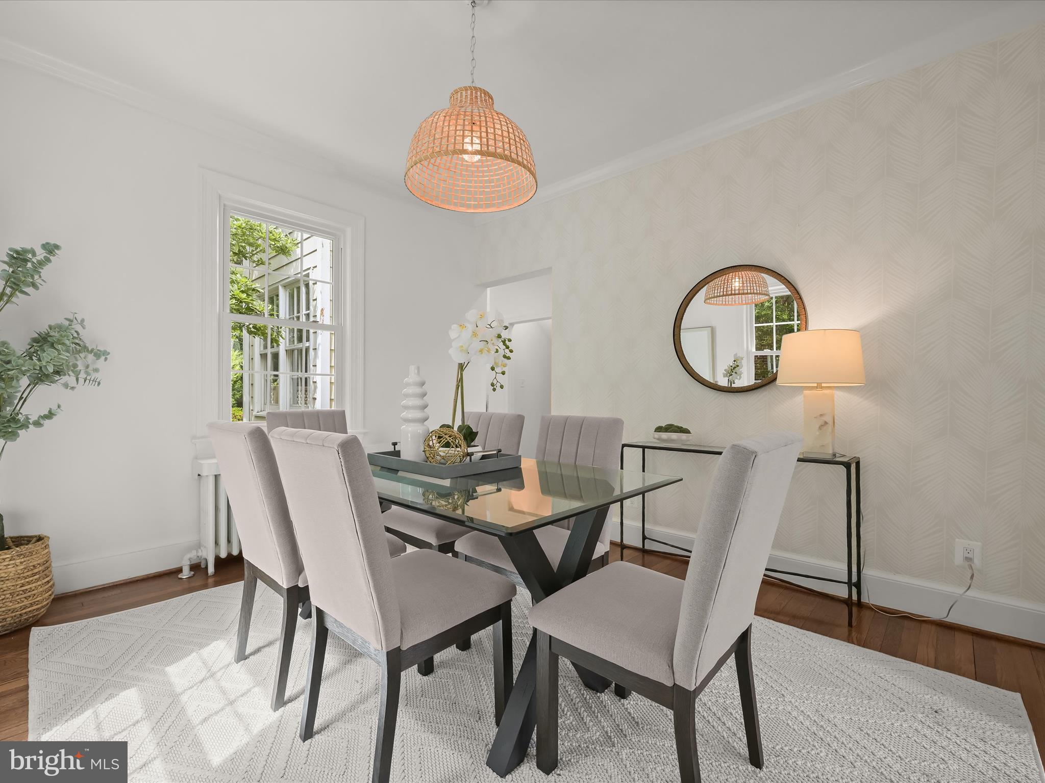 8028 Maple Ridge Road Bethesda, MD 20814 - Photo 8 of 51 a view of a dining room with furniture and wooden floor