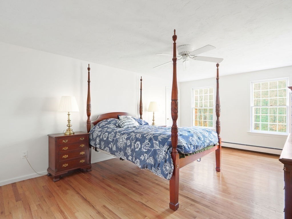 97 Pine Street Medfield, MA 02052 - Photo 16 of 29 a bedroom with a bed window and a table