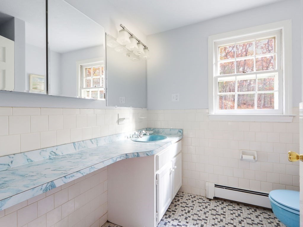 97 Pine Street Medfield, MA 02052 - Photo 18 of 29 a bathroom with a sink toilet and window