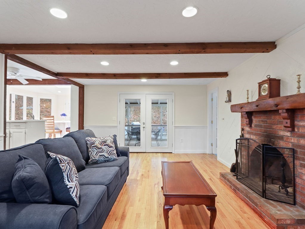 97 Pine Street Medfield, MA 02052 - Photo 4 of 29 a living room with furniture and a fireplace