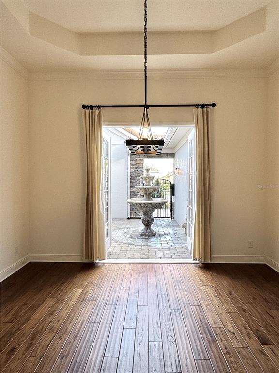 416 Blue Birch Court Sanford, FL 32771 - Photo 13 of 36 a view of a room with wooden floor a ceiling fan and kitchen space