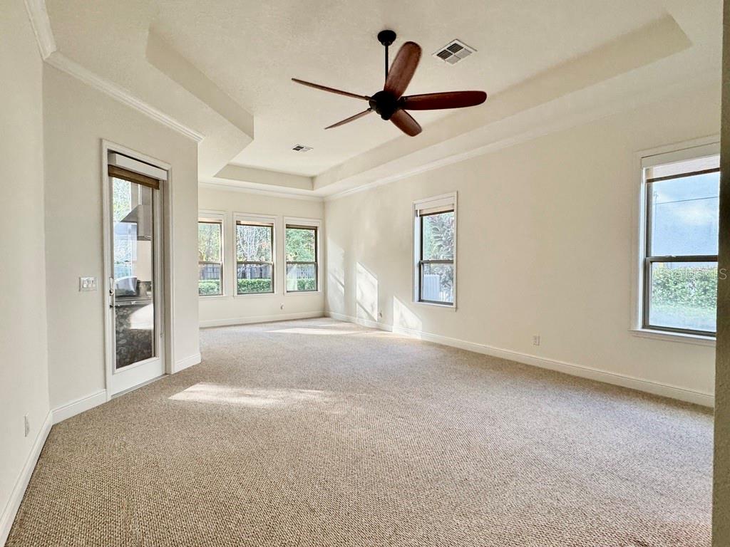 416 Blue Birch Court Sanford, FL 32771 - Photo 15 of 36 a view of a livingroom with a ceiling fan & windows