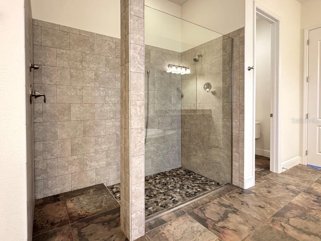 416 Blue Birch Court Sanford, FL 32771 - Photo 16 of 36 a bathroom with a shower and a sink