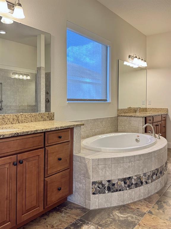 416 Blue Birch Court Sanford, FL 32771 - Photo 17 of 36 a bathroom with a sink and a mirror