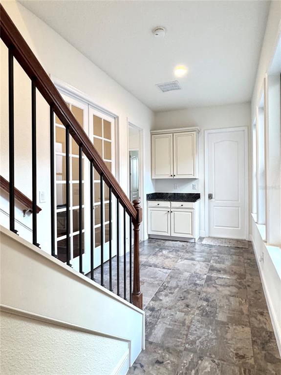 416 Blue Birch Court Sanford, FL 32771 - Photo 23 of 36 a view of a hallway with wooden floor and staircase