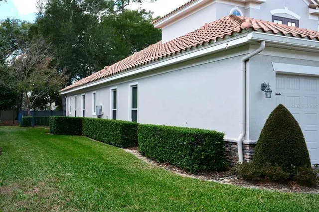 a house with green field in front of it