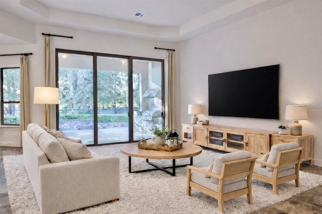 416 Blue Birch Court Sanford, FL 32771 - Photo 4 of 36 a living room with furniture and a flat screen tv