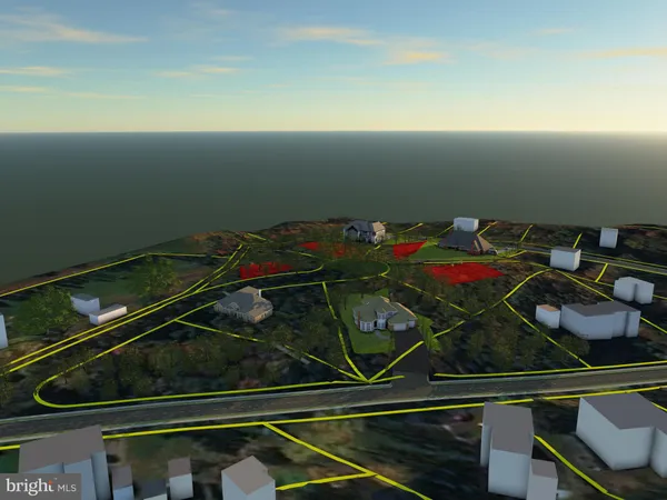 a view of a book and a white bed