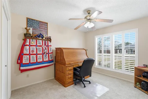 a dining room with furniture and window