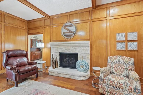 a living room with furniture a window and a fireplace
