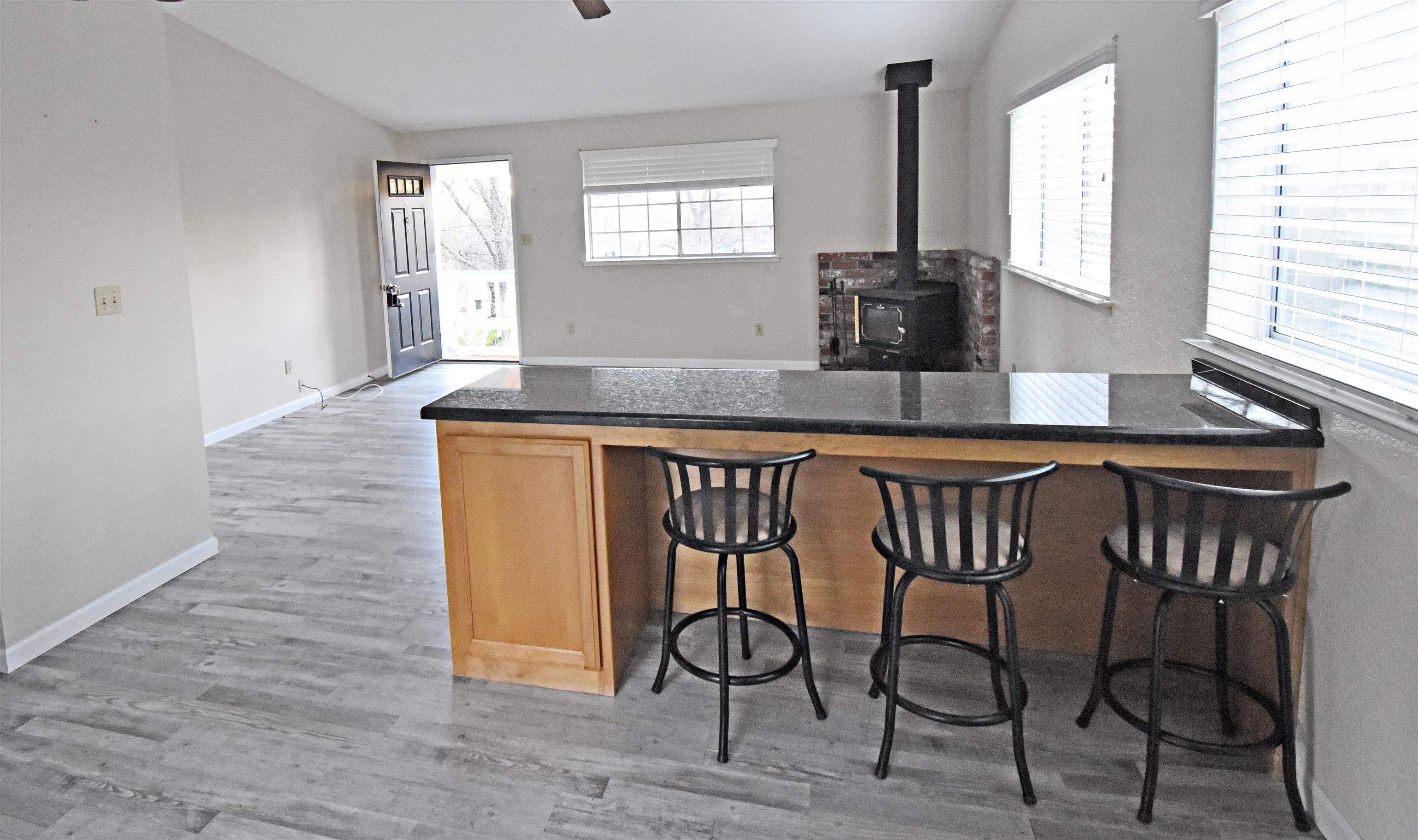 19283 James Circle Groveland, CA 95321 - Photo 12 of 40 a kitchen that has a table and chairs in it