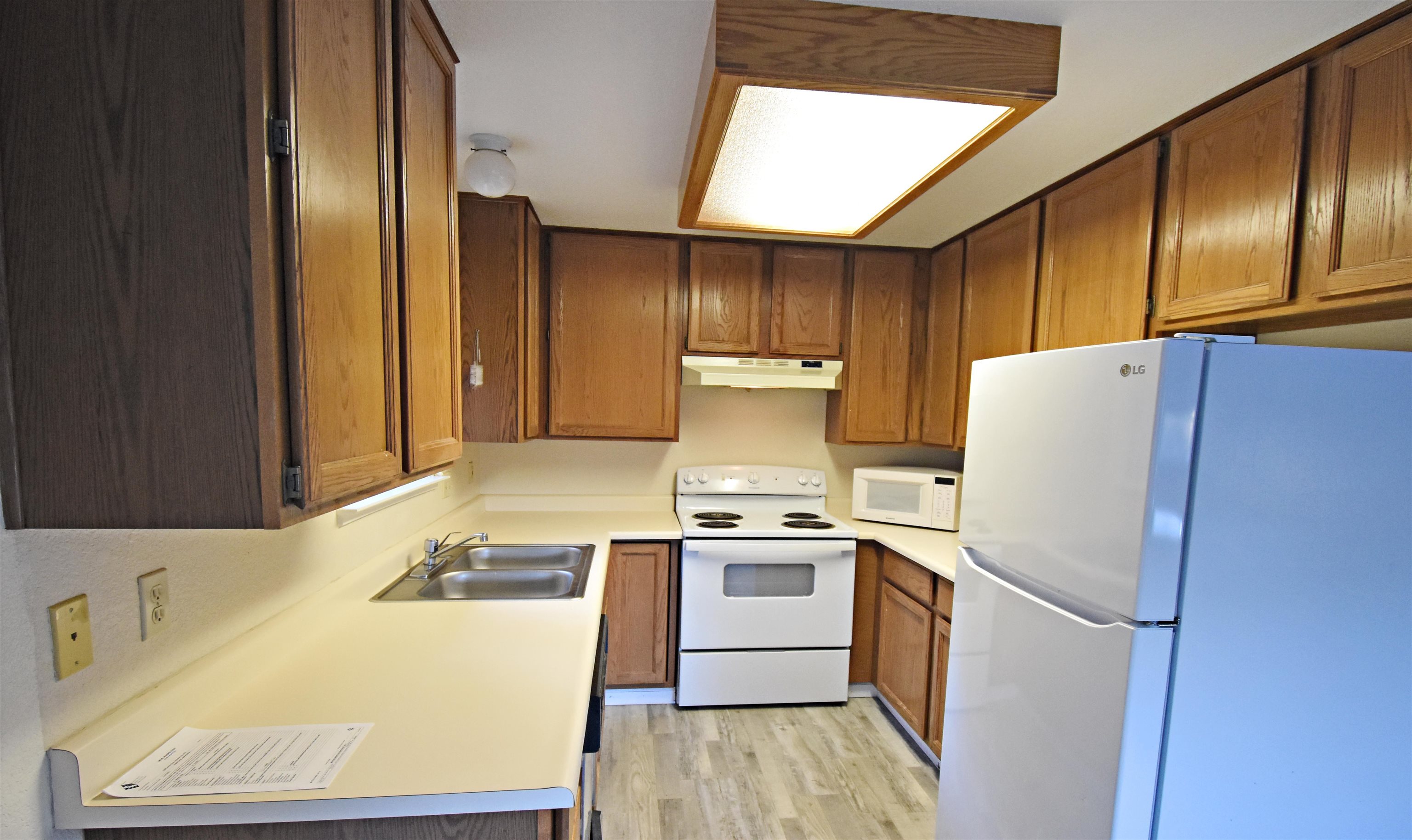 19283 James Circle Groveland, CA 95321 - Photo 13 of 40 a white refrigerator freezer sitting inside of a kitchen
