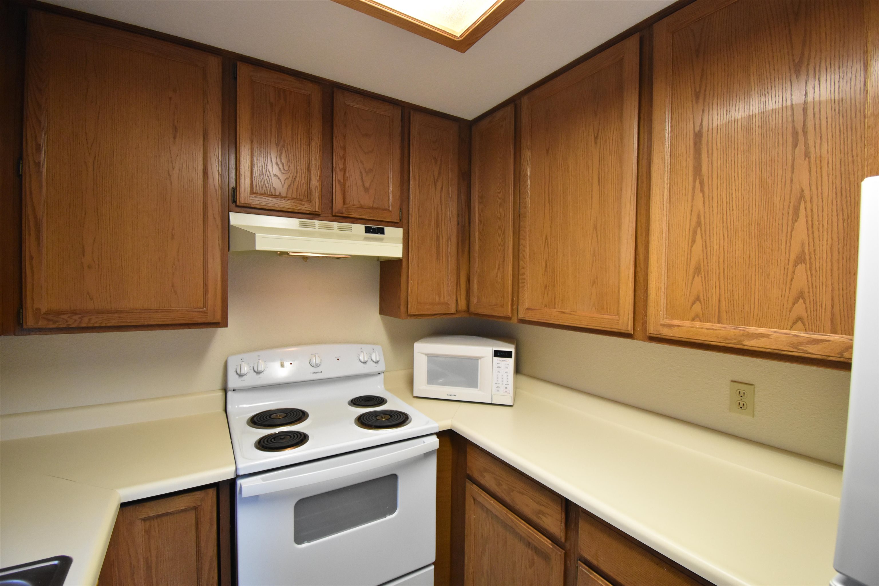 19283 James Circle Groveland, CA 95321 - Photo 17 of 40 a kitchen with a stove and a microwave