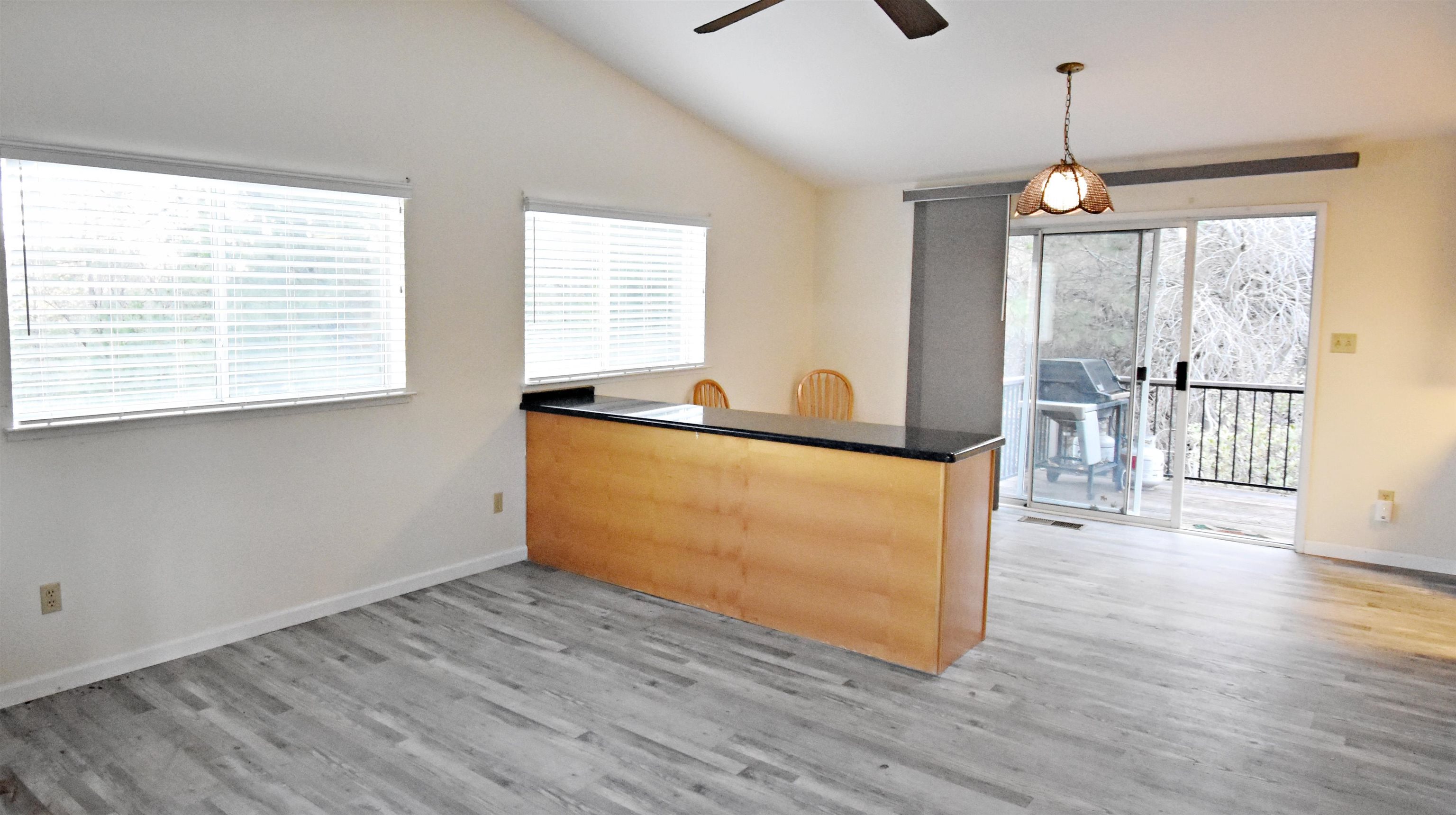 19283 James Circle Groveland, CA 95321 - Photo 8 of 40 a view of a room with wooden floor and outdoor space