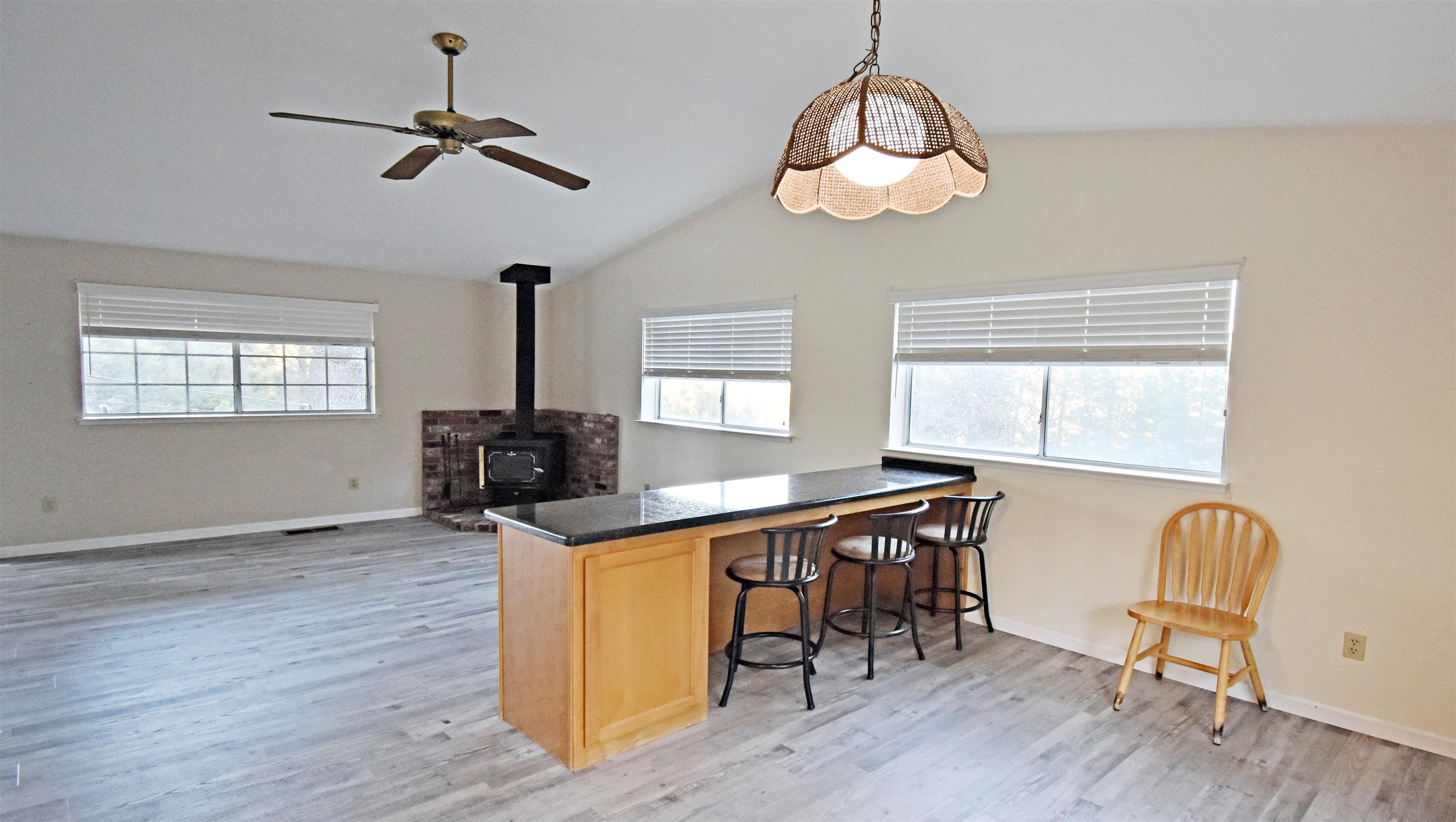 19283 James Circle Groveland, CA 95321 - Photo 9 of 40 a view of a dining room with furniture window and wooden floor
