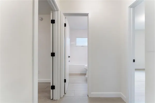 a view of a bathroom with a glass shower door