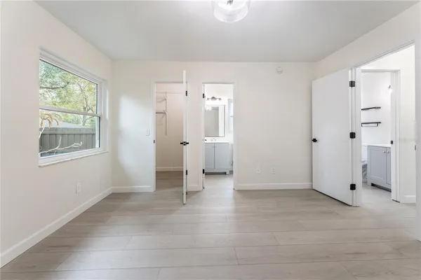 a view of an empty room with a window