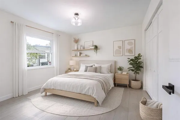a bedroom with a bed and a couch