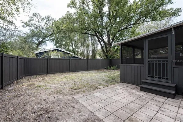 a house with a trees in the back yard