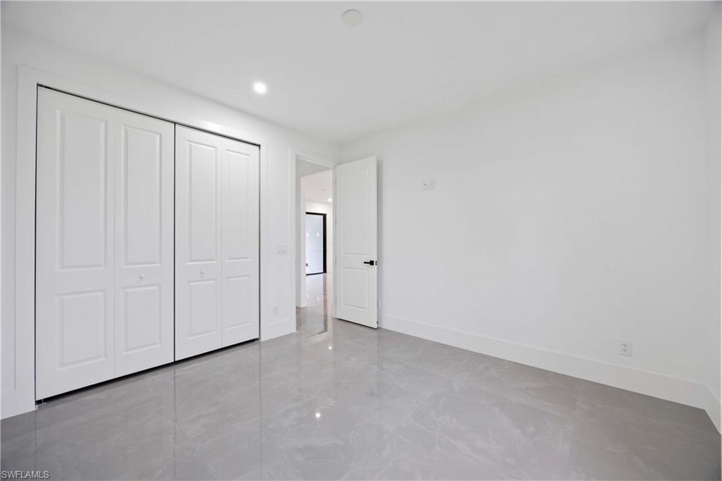 3908 Sunset Road Lehigh Acres, FL 33971 - Photo 21 of 30 a view of an empty room