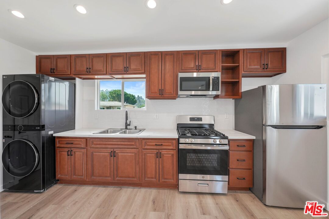 510 East Palmer Avenue Glendale, CA 91205 - Photo 12 of 26 a kitchen with a stove a sink and a refrigerator