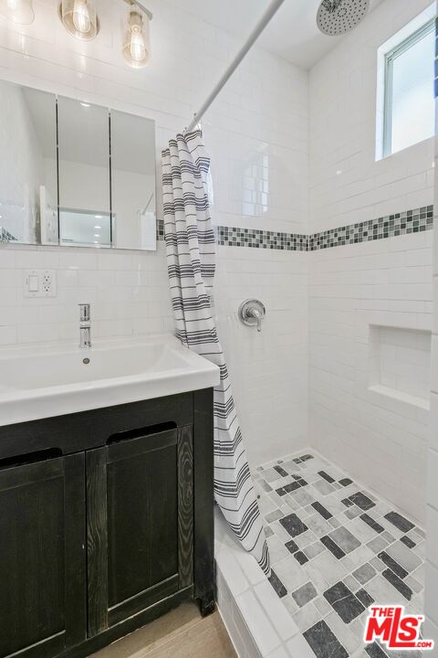 510 East Palmer Avenue Glendale, CA 91205 - Photo 22 of 26 a bathroom with a sink and a mirror